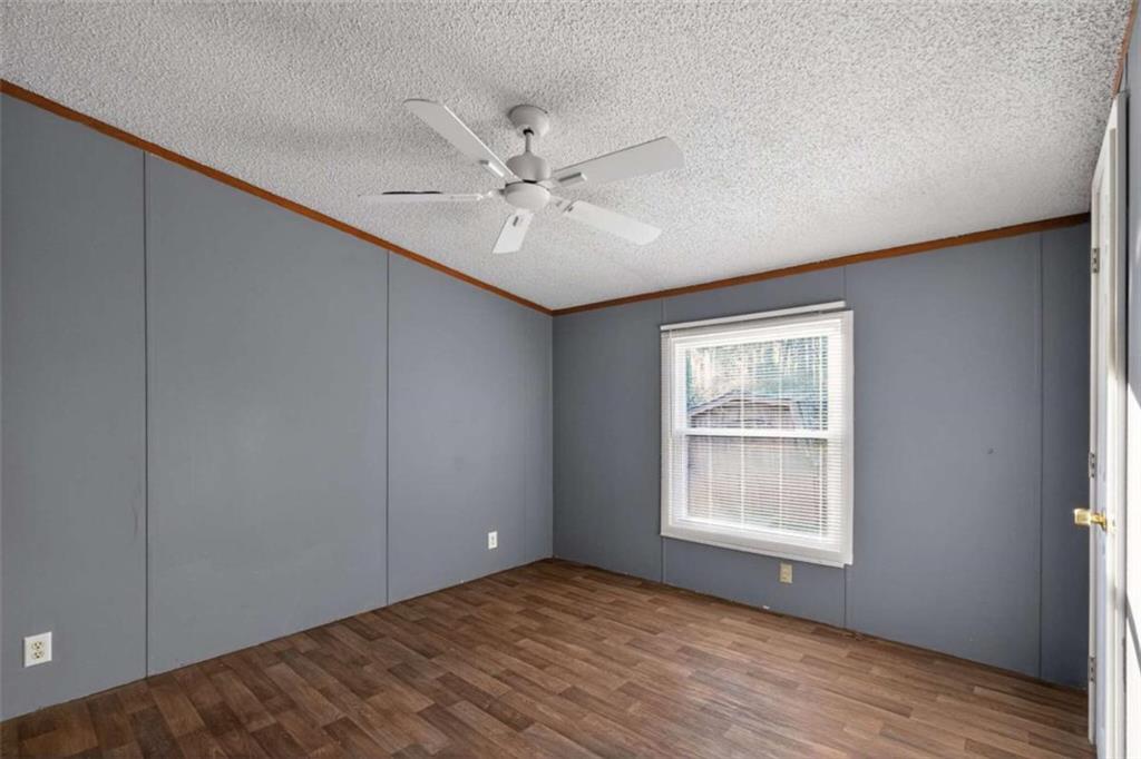205 Wilson Road Stockbridge, GA 30281 - Photo 11 of 18 a view of an empty room with a window