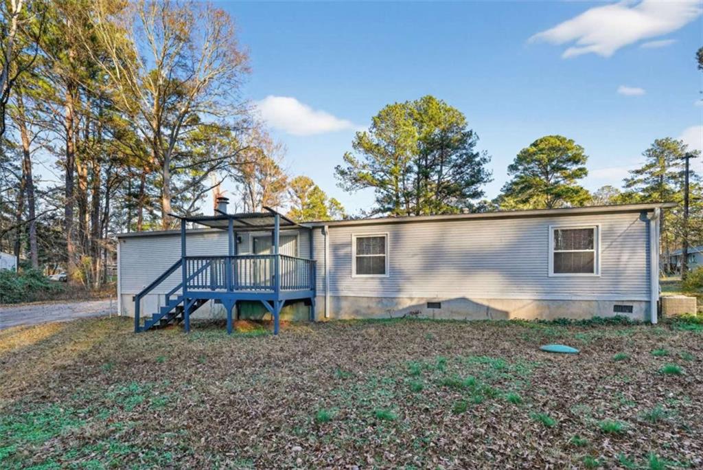 205 Wilson Road Stockbridge, GA 30281 - Photo 17 of 18 front view of a house with a large tree