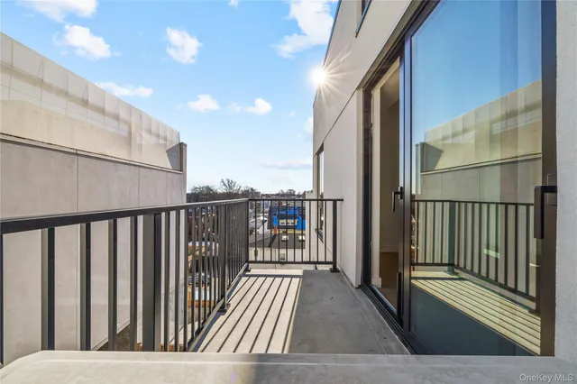 a view of balcony with wooden floor