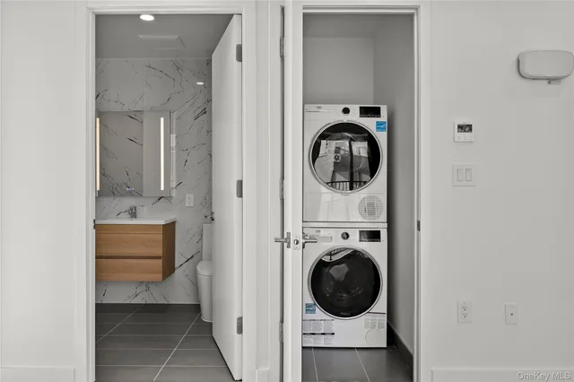 a view of a hallway with washer and dryer