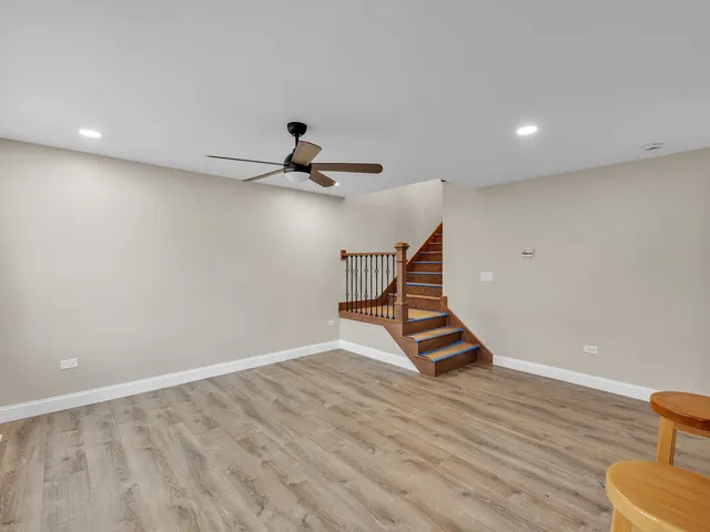 a view of an empty room with stairs and ventilation