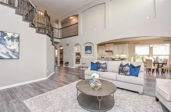 a living room with furniture or couch and a dining table