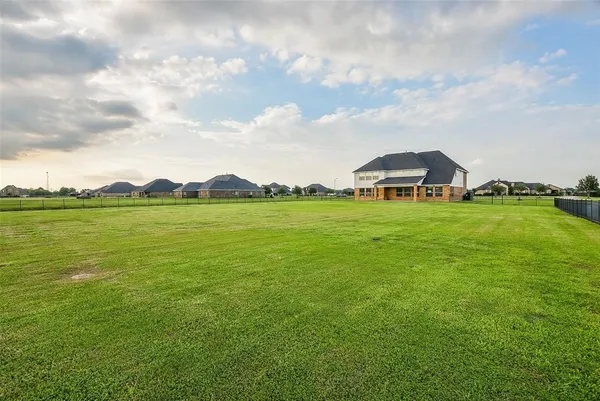 a view of a lake with a big yard