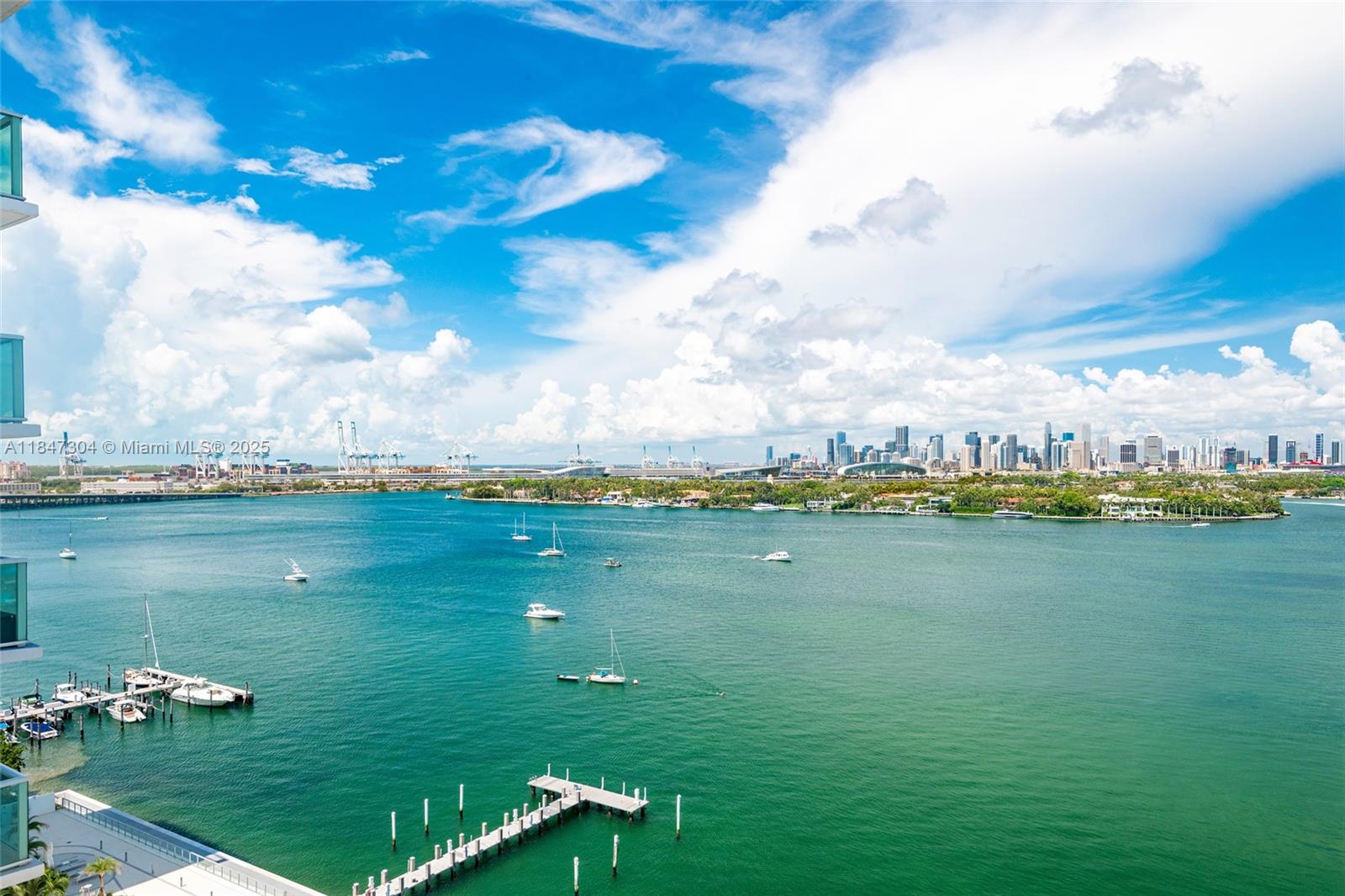 a view of a lake with houses in the back