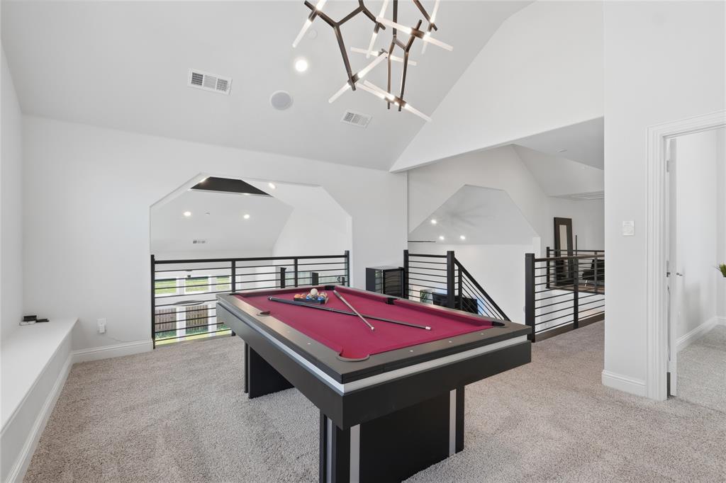 7548 Ridge Lane Grand Prairie, TX 75054 - Photo 24 of 35 Playroom with billiards table, light carpet, suspended lighting, and vaulted ceiling