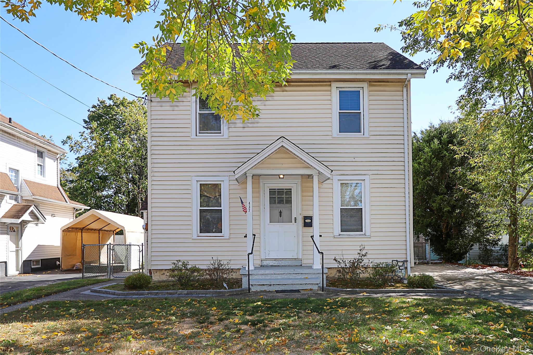 a front view of a house with a yard