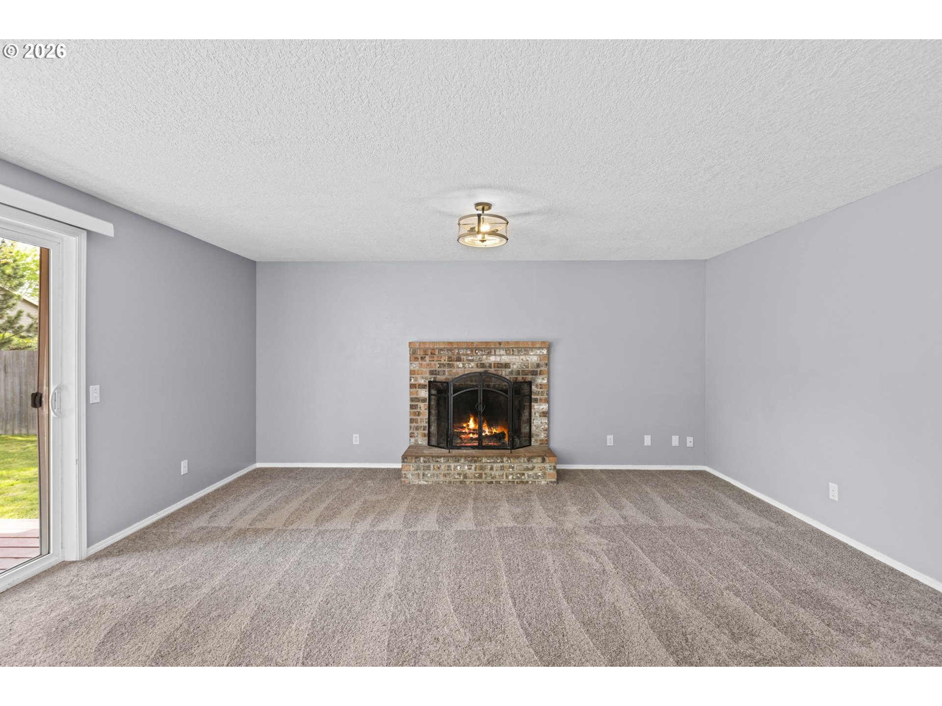 21558 Southwest Longacre Street Beaverton, OR 97003 - Photo 15 of 41 a view of an empty room and a window