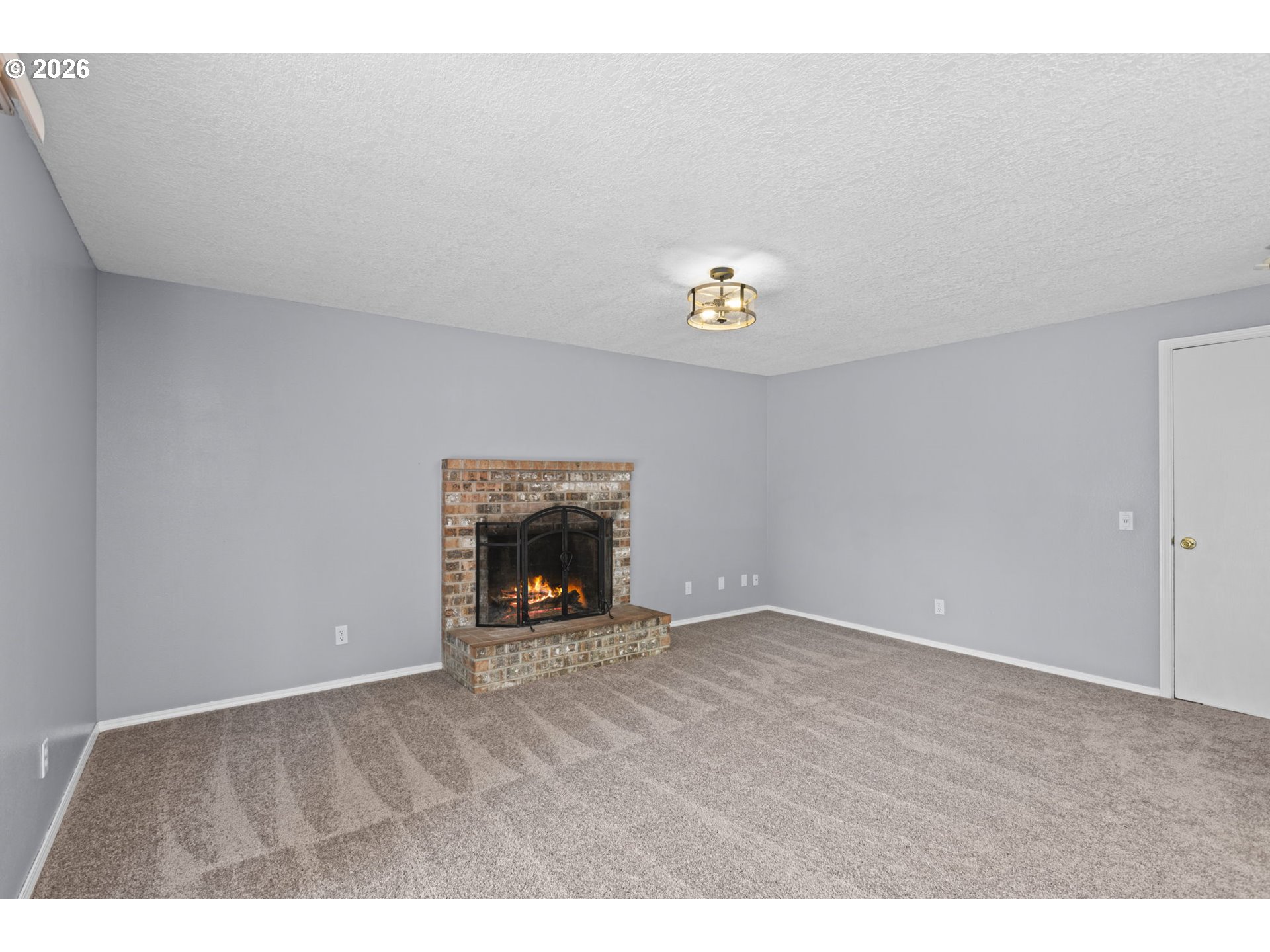 21558 Southwest Longacre Street Beaverton, OR 97003 - Photo 16 of 41 a view of an empty room with a fireplace