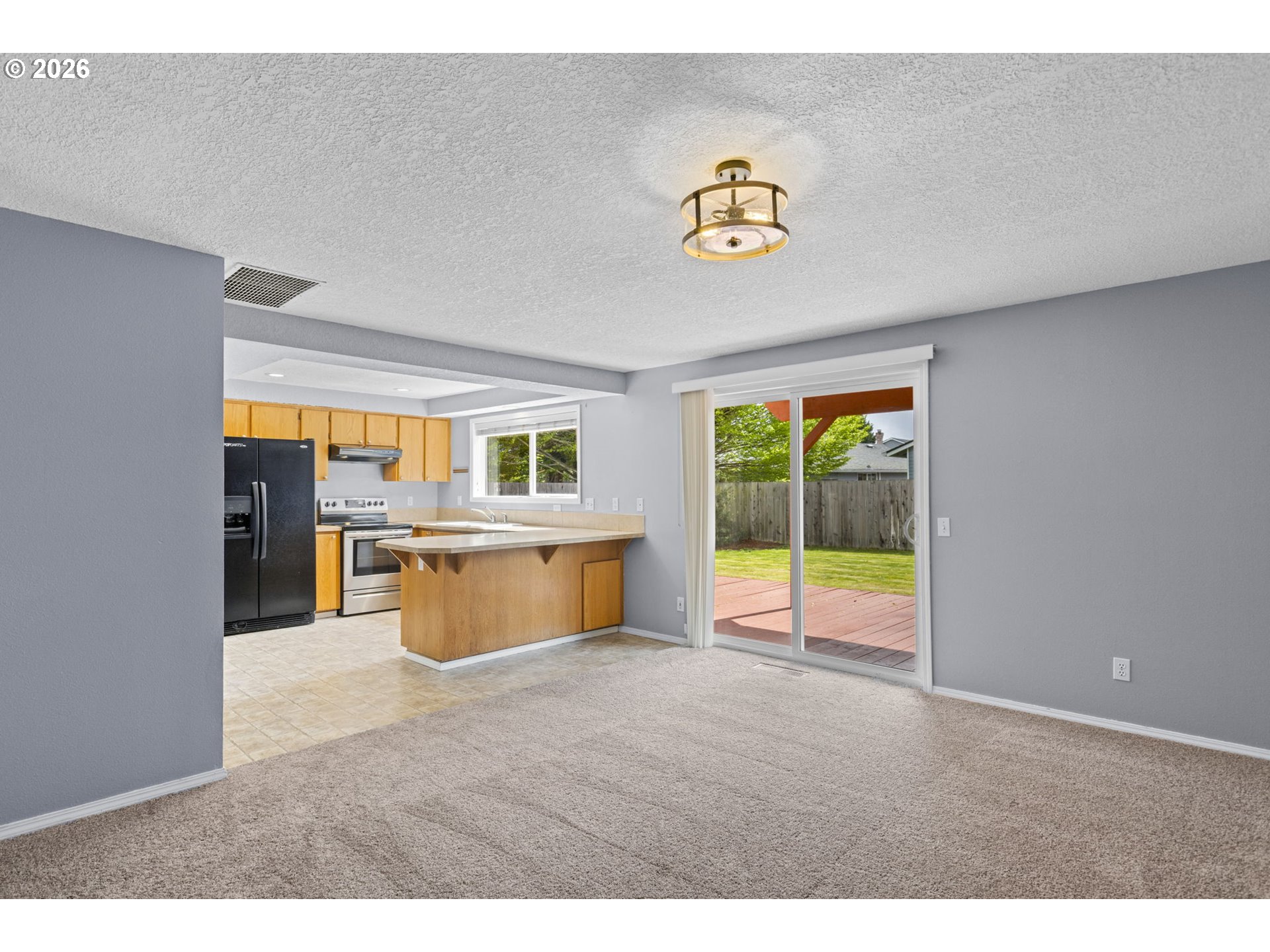 21558 Southwest Longacre Street Beaverton, OR 97003 - Photo 17 of 41 a view of an empty room with a window
