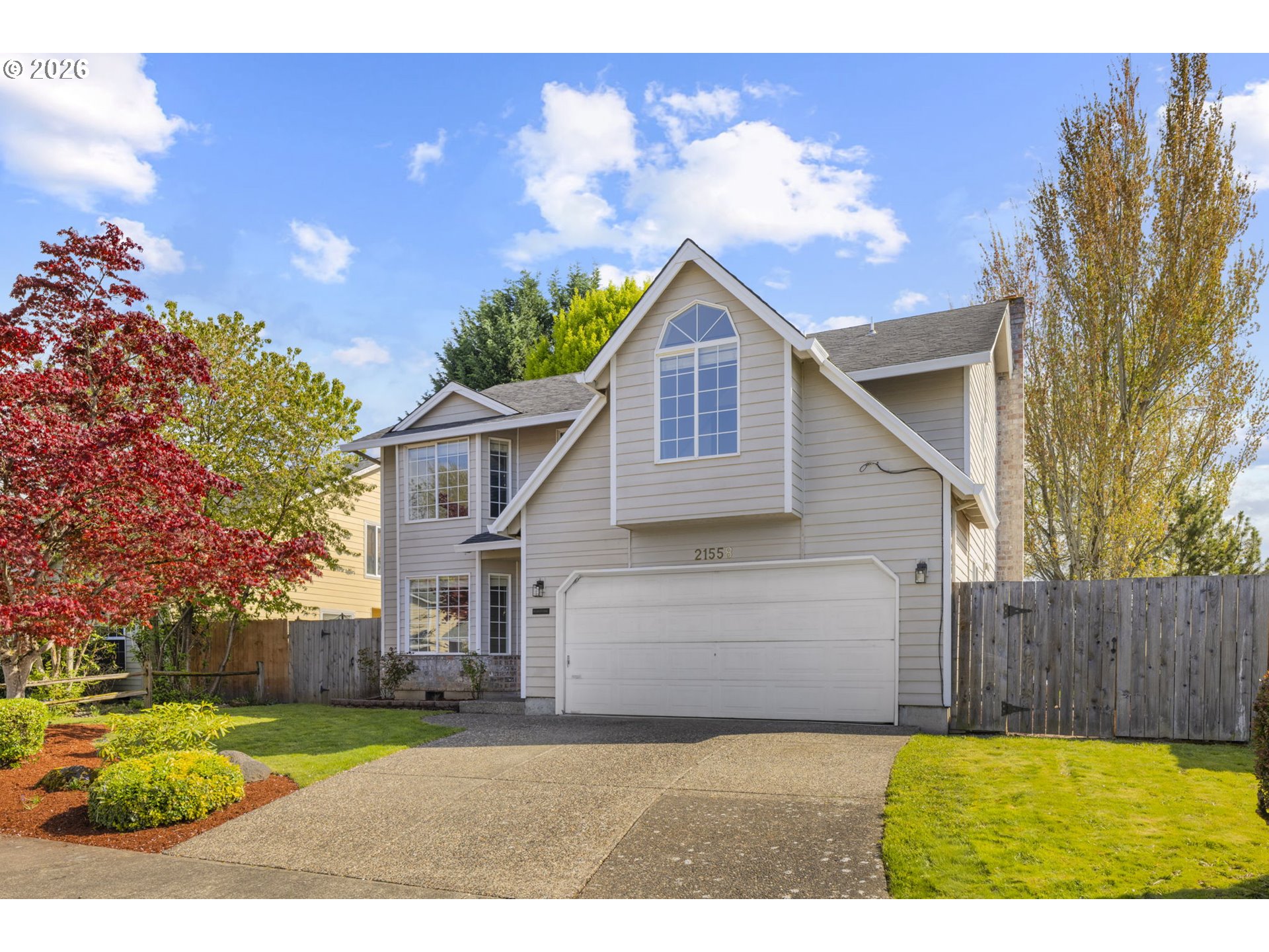 21558 Southwest Longacre Street Beaverton, OR 97003 - Photo 2 of 41 a view of a back yard of the house