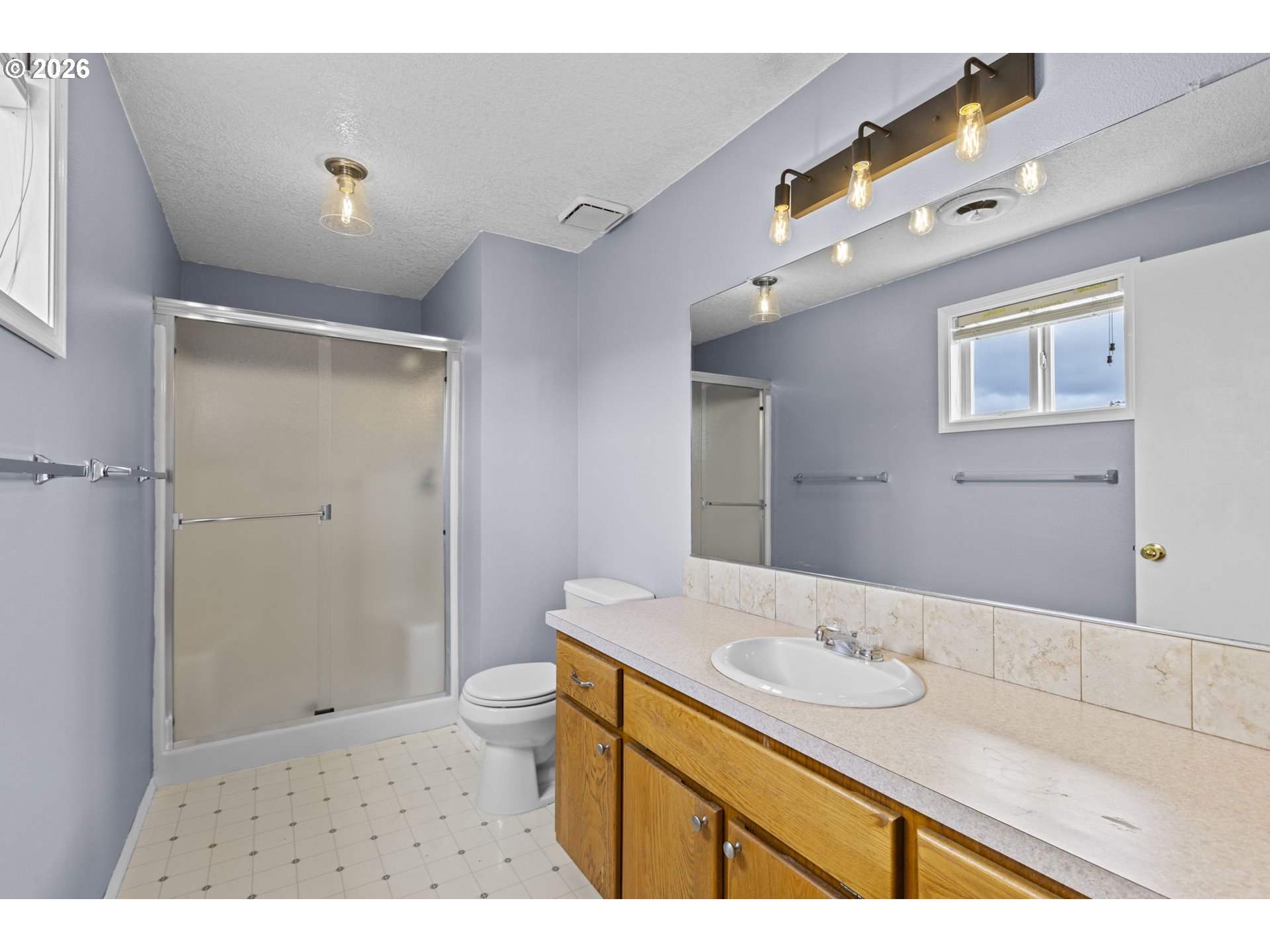 21558 Southwest Longacre Street Beaverton, OR 97003 - Photo 23 of 41 a bathroom with a sink and a mirror