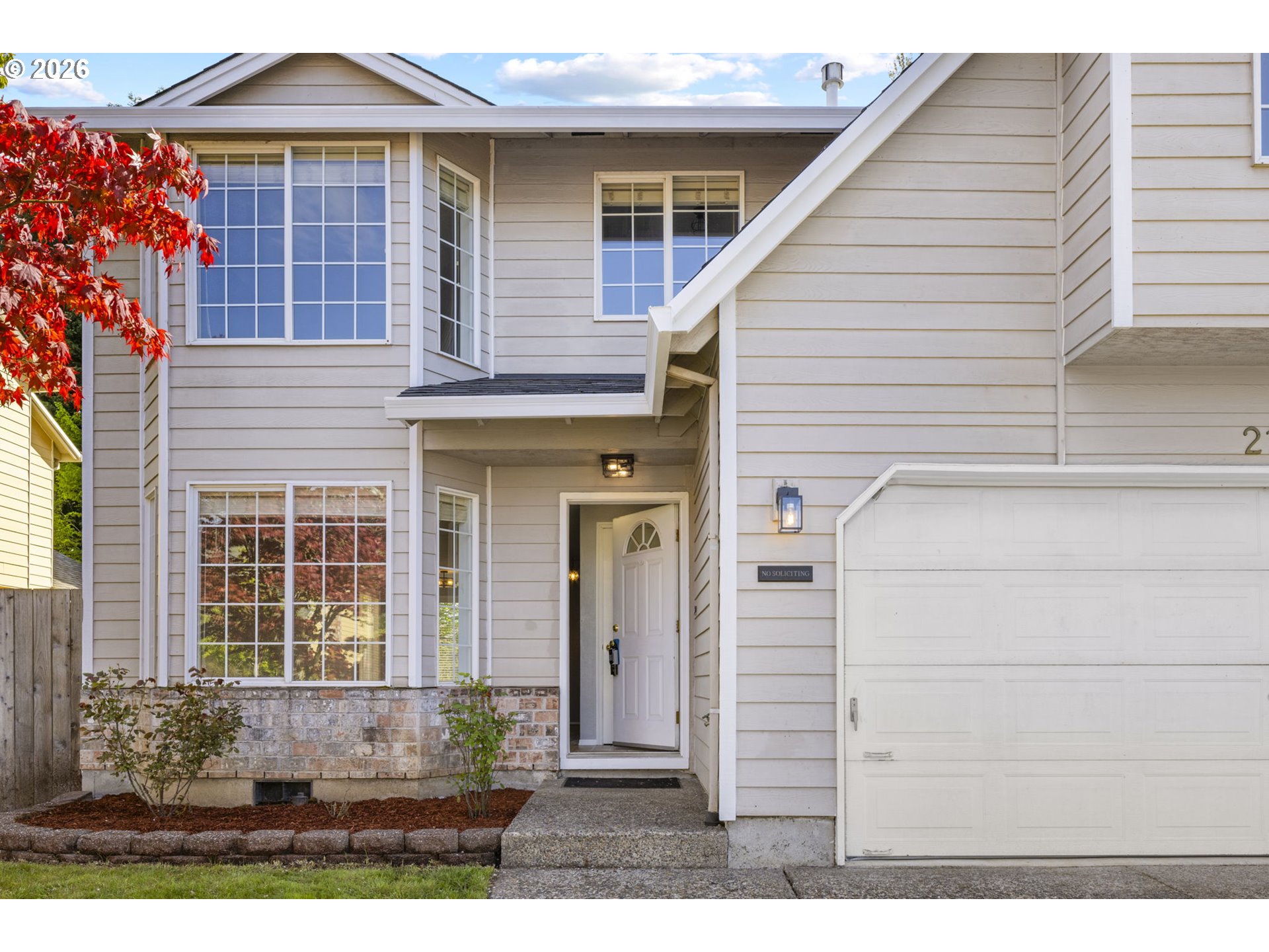 21558 Southwest Longacre Street Beaverton, OR 97003 - Photo 3 of 41 a front view of a house with a yard