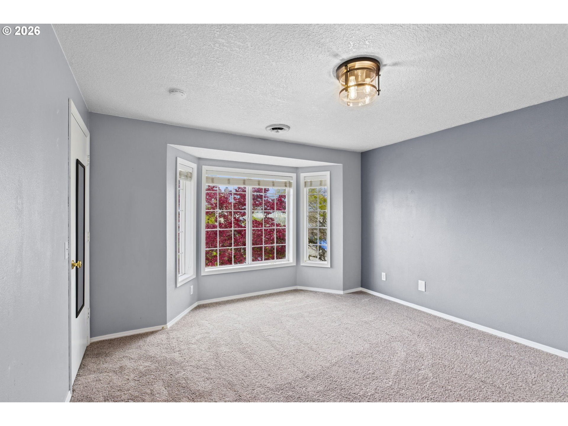 21558 Southwest Longacre Street Beaverton, OR 97003 - Photo 31 of 41 a view of an empty room with a window
