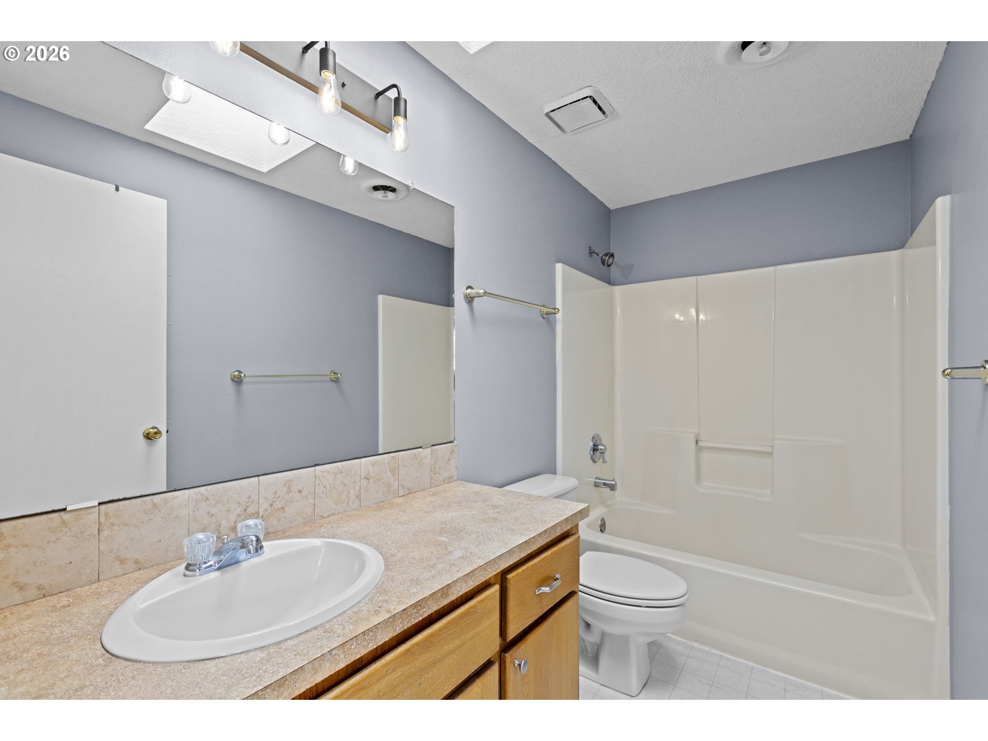 21558 Southwest Longacre Street Beaverton, OR 97003 - Photo 32 of 41 a bathroom with a sink toilet and shower