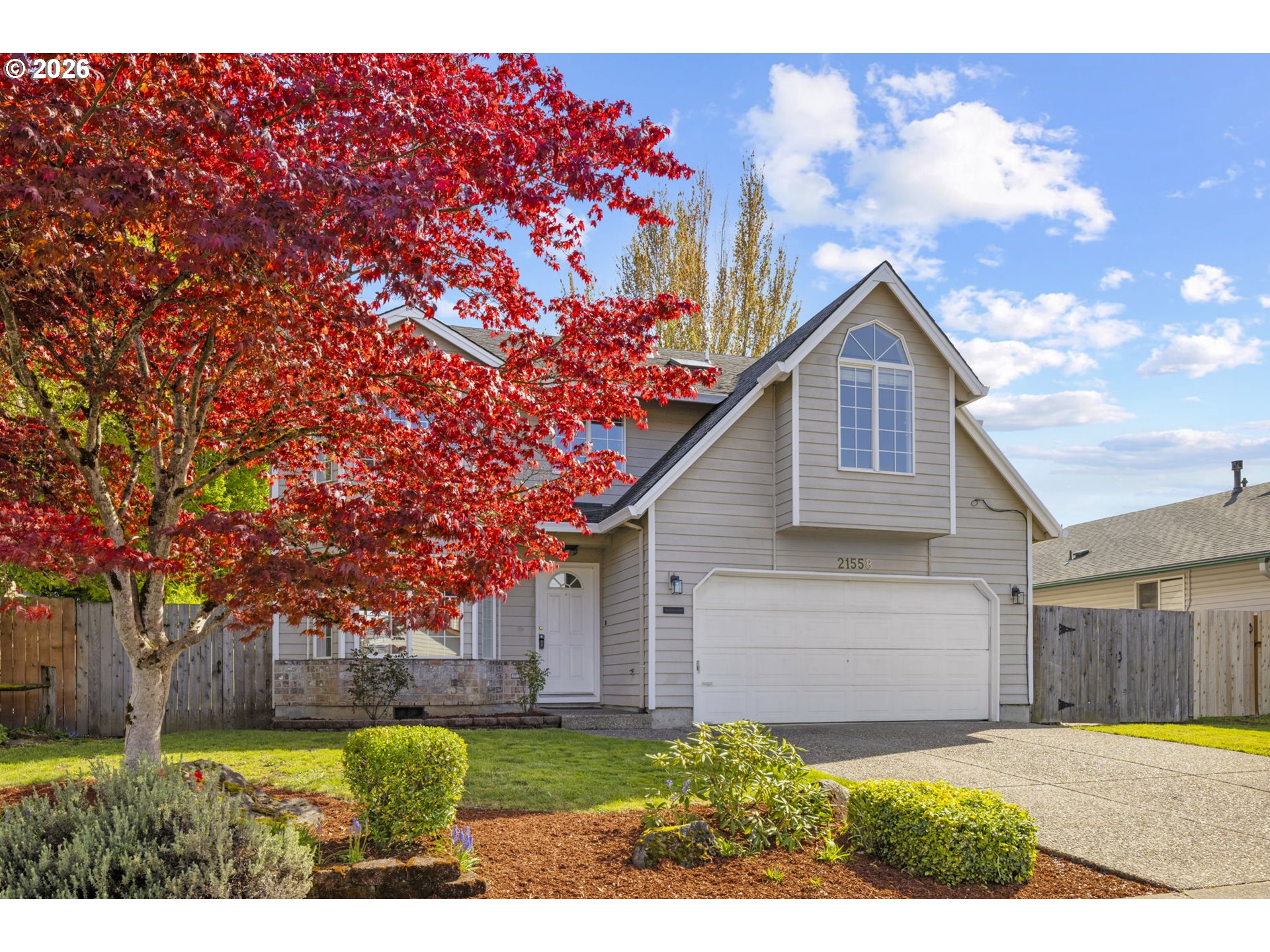 21558 Southwest Longacre Street Beaverton, OR 97003 - Photo 40 of 41 a front view of a house with a yard