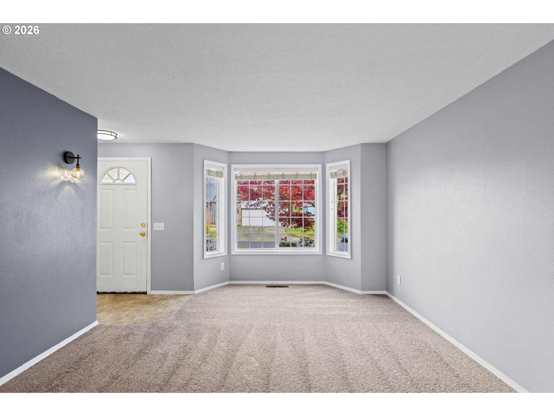 21558 Southwest Longacre Street Beaverton, OR 97003 - Photo 7 of 41 a view of an empty room with a window