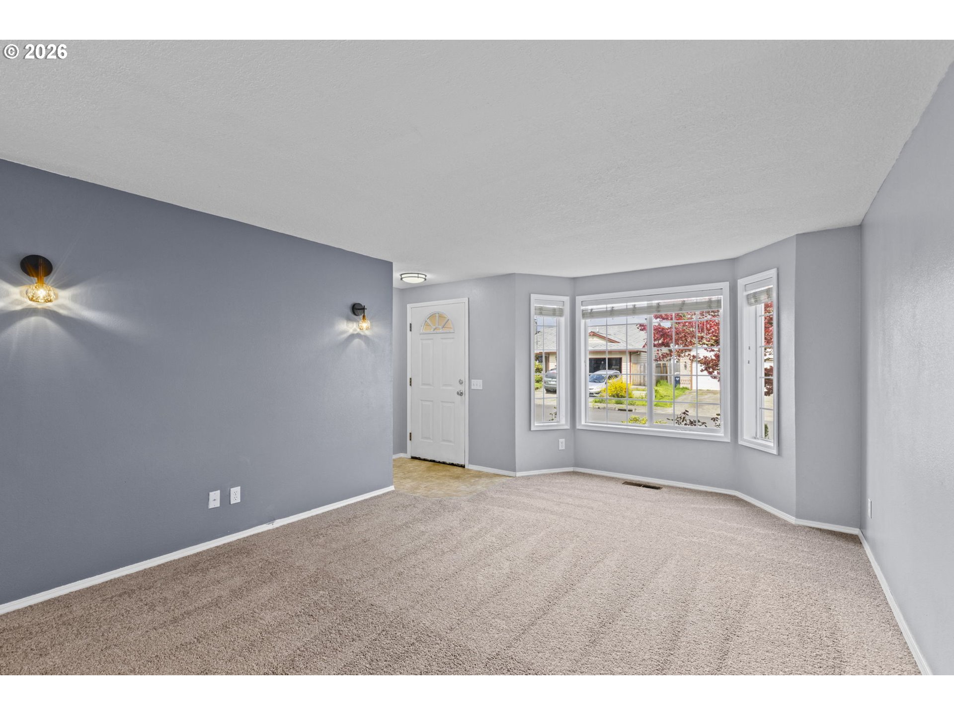 21558 Southwest Longacre Street Beaverton, OR 97003 - Photo 8 of 41 a view of an empty room with a window