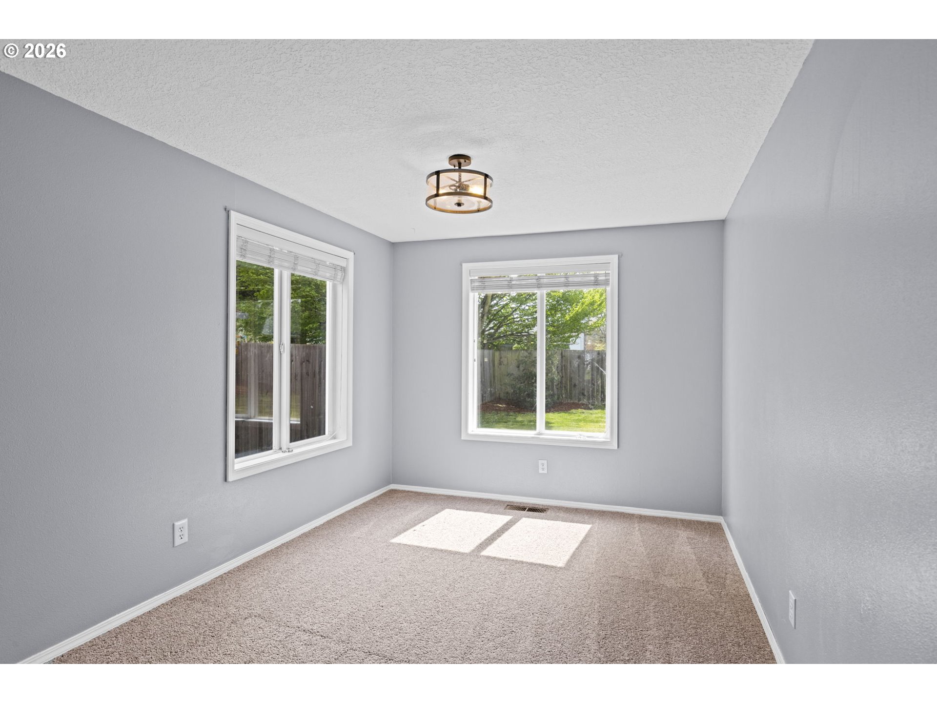 21558 Southwest Longacre Street Beaverton, OR 97003 - Photo 10 of 41 a view of an empty room with a window