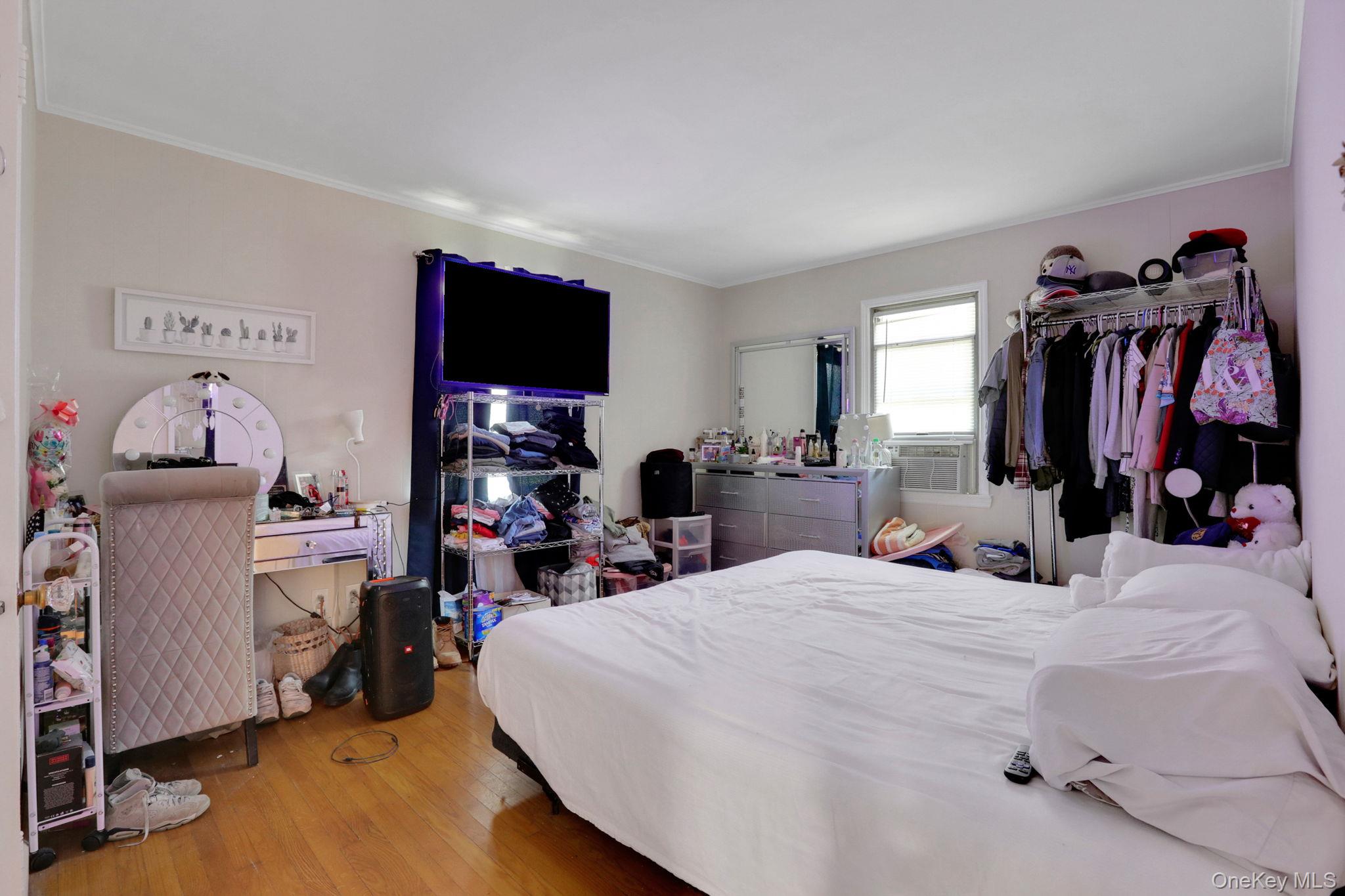 27 Osborne Hill Road Wappingers Falls, NY 12590 - Photo 17 of 31 Bedroom with crown molding, light wood finished floors, and cooling unit