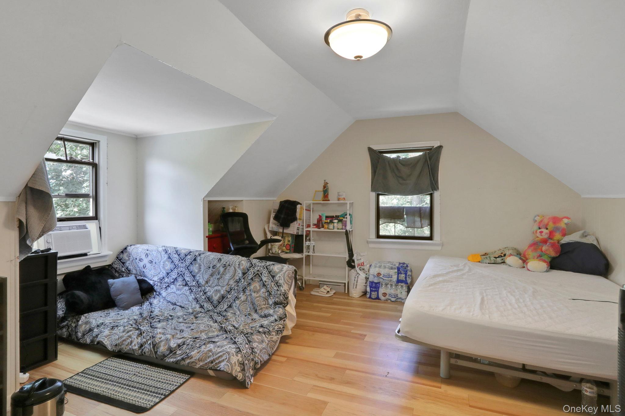 27 Osborne Hill Road Wappingers Falls, NY 12590 - Photo 19 of 31 Bedroom featuring light wood-type flooring and lofted ceiling