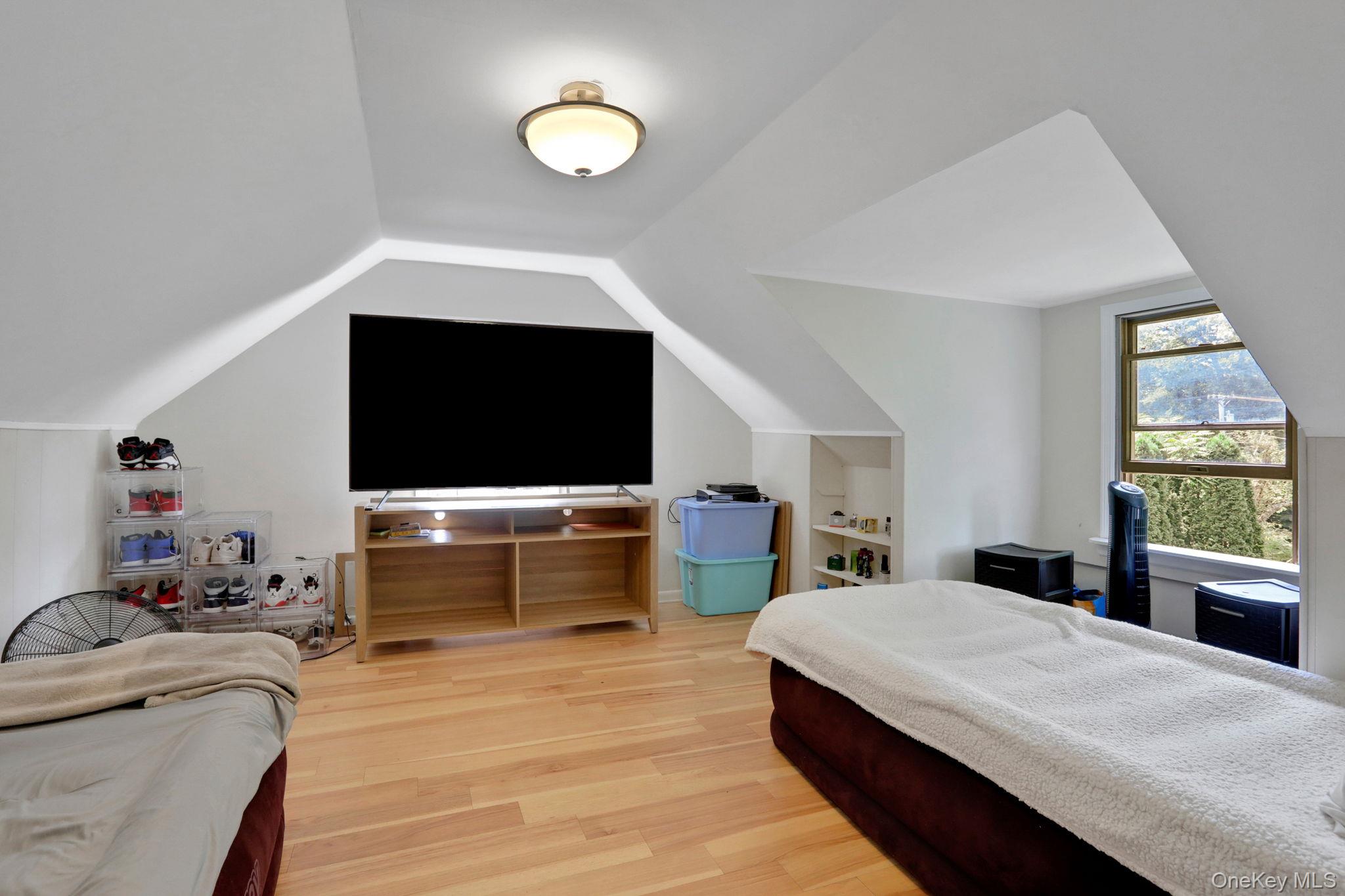 27 Osborne Hill Road Wappingers Falls, NY 12590 - Photo 20 of 31 Bedroom with light wood-style floors and vaulted ceiling