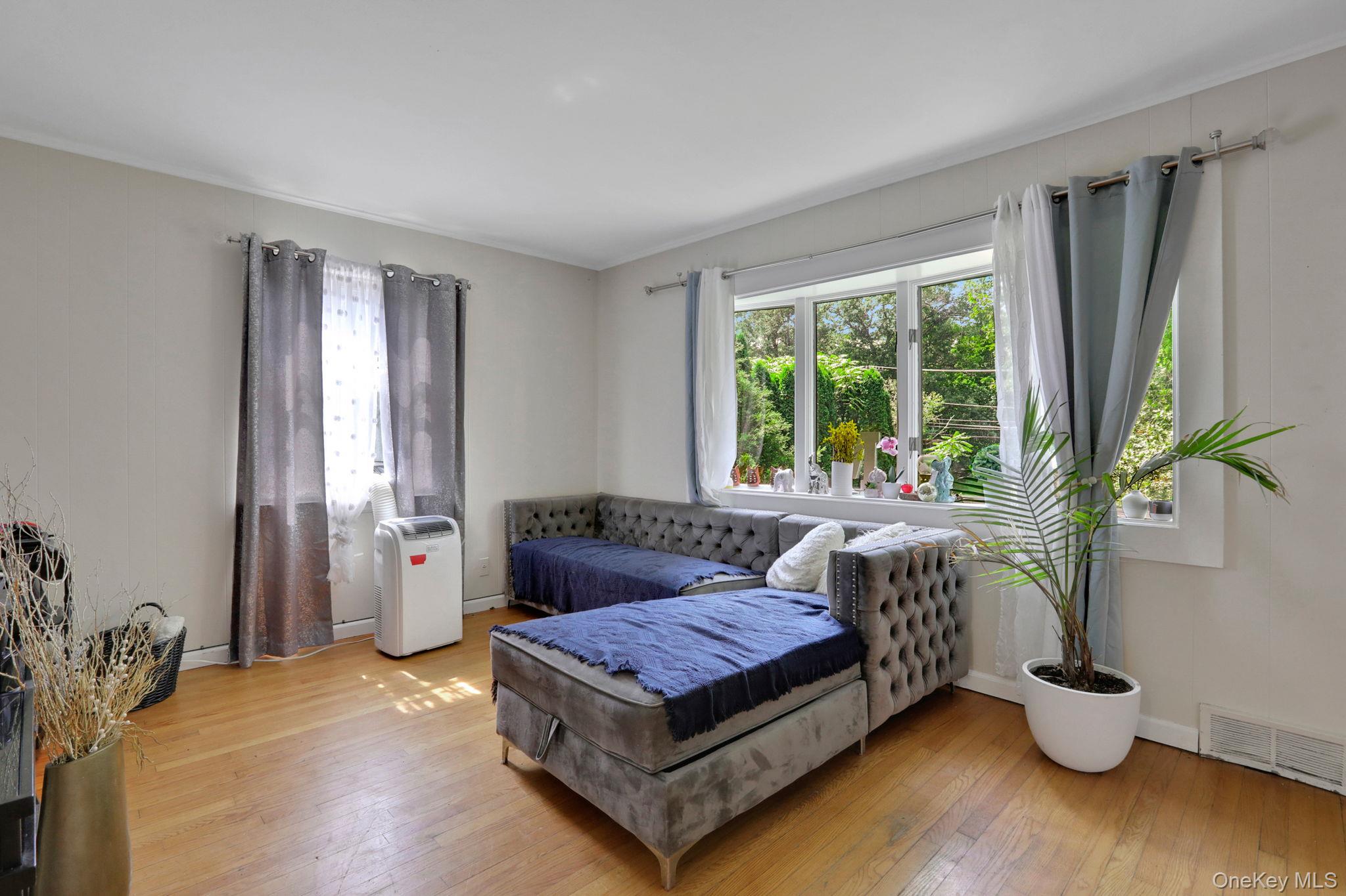 27 Osborne Hill Road Wappingers Falls, NY 12590 - Photo 6 of 31 Bedroom featuring multiple windows and light wood finished floors