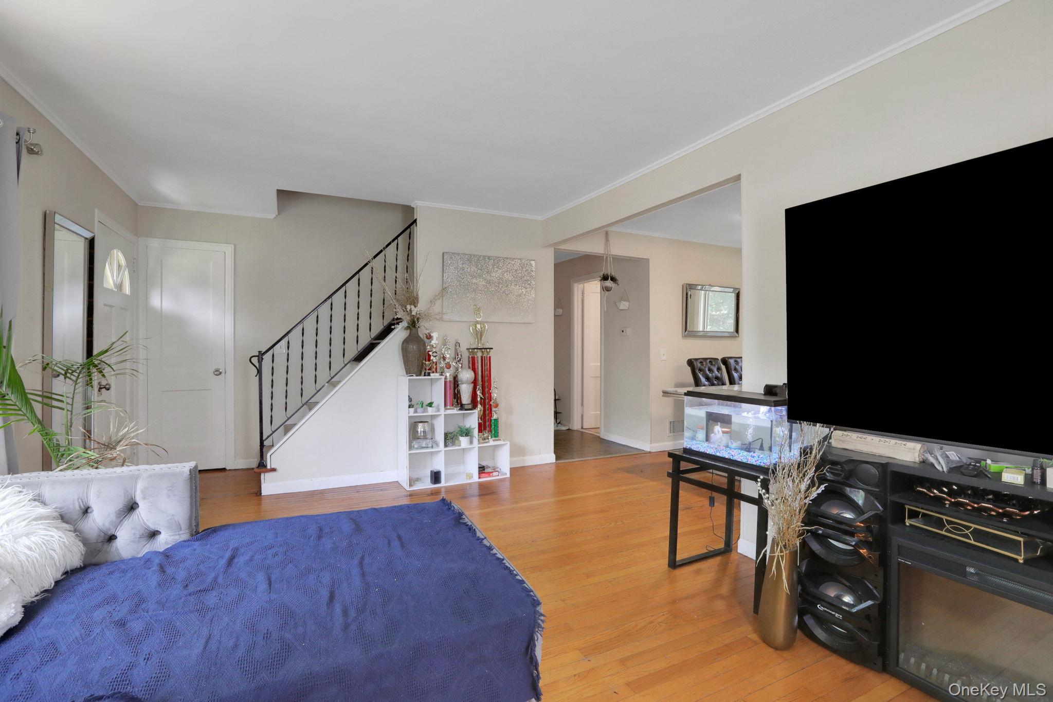 27 Osborne Hill Road Wappingers Falls, NY 12590 - Photo 7 of 31 Bedroom featuring light wood-style floors and crown molding