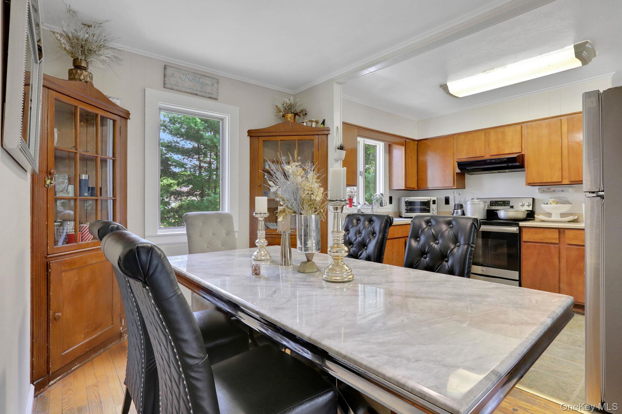 27 Osborne Hill Road Wappingers Falls, NY 12590 - Photo 10 of 31 Dining area featuring crown molding and light wood finished floors