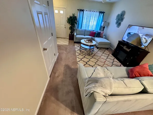 a bed room with a bed and a chair