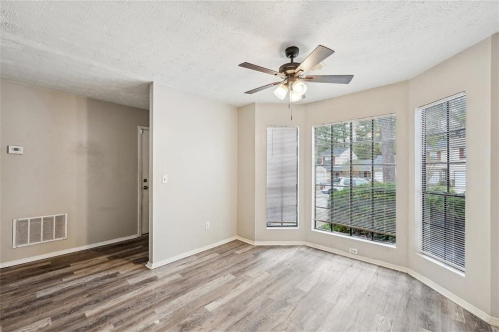 703 Pine Tree Trail Atlanta, GA 30349 - Photo 8 of 32 a view of an empty room with a window