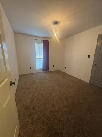 a view of a big room with windows