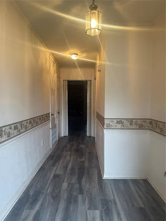 a view of a room with wooden floor and staircase