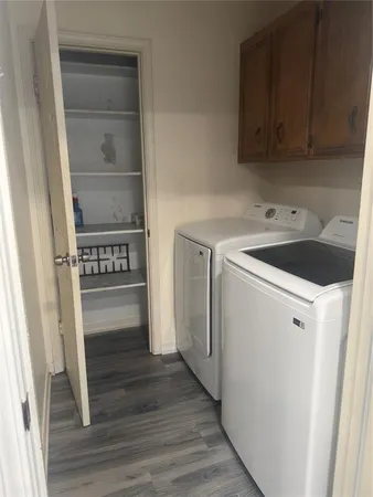 a kitchen with a refrigerator and a stove