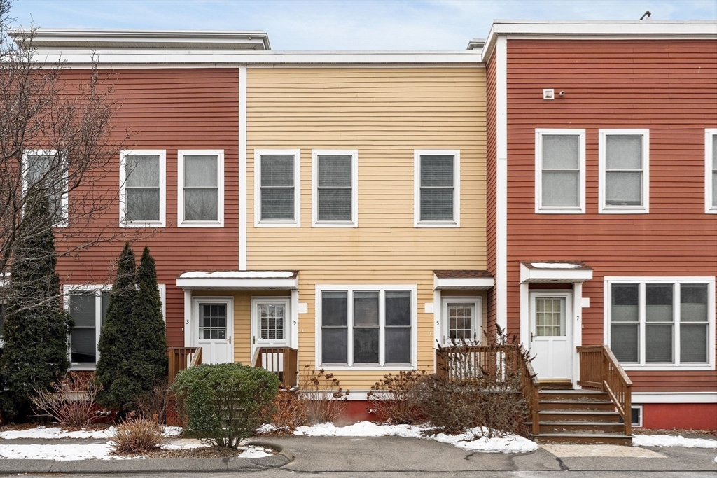 910 Saratoga Street, Unit 5 Boston, MA 02128 - Photo 18 of 24 a front view of a house with a yard