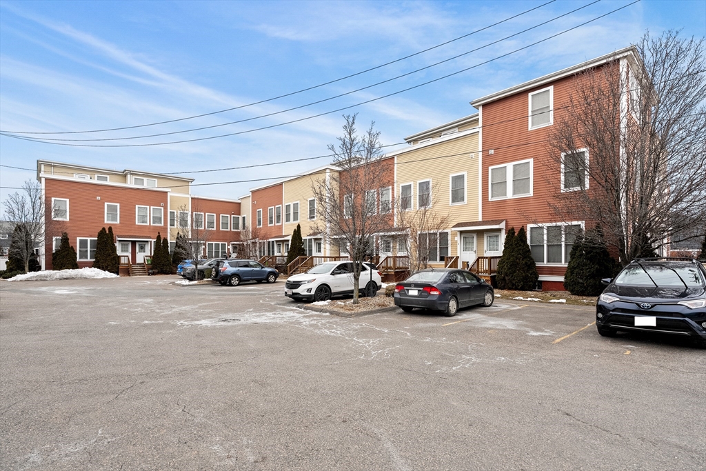 910 Saratoga Street, Unit 5 Boston, MA 02128 - Photo 21 of 24 a view of a cars parked in front of a building