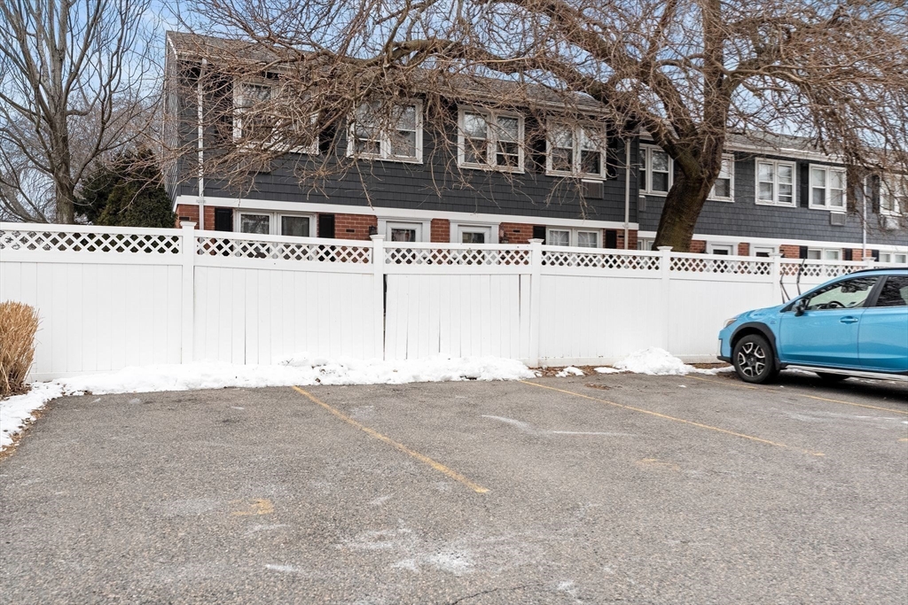 910 Saratoga Street, Unit 5 Boston, MA 02128 - Photo 23 of 24 a building with trees in front of it