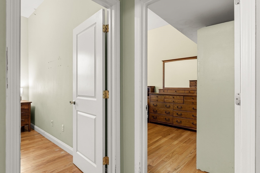 910 Saratoga Street, Unit 5 Boston, MA 02128 - Photo 10 of 24 a view of a bathroom from a hallway