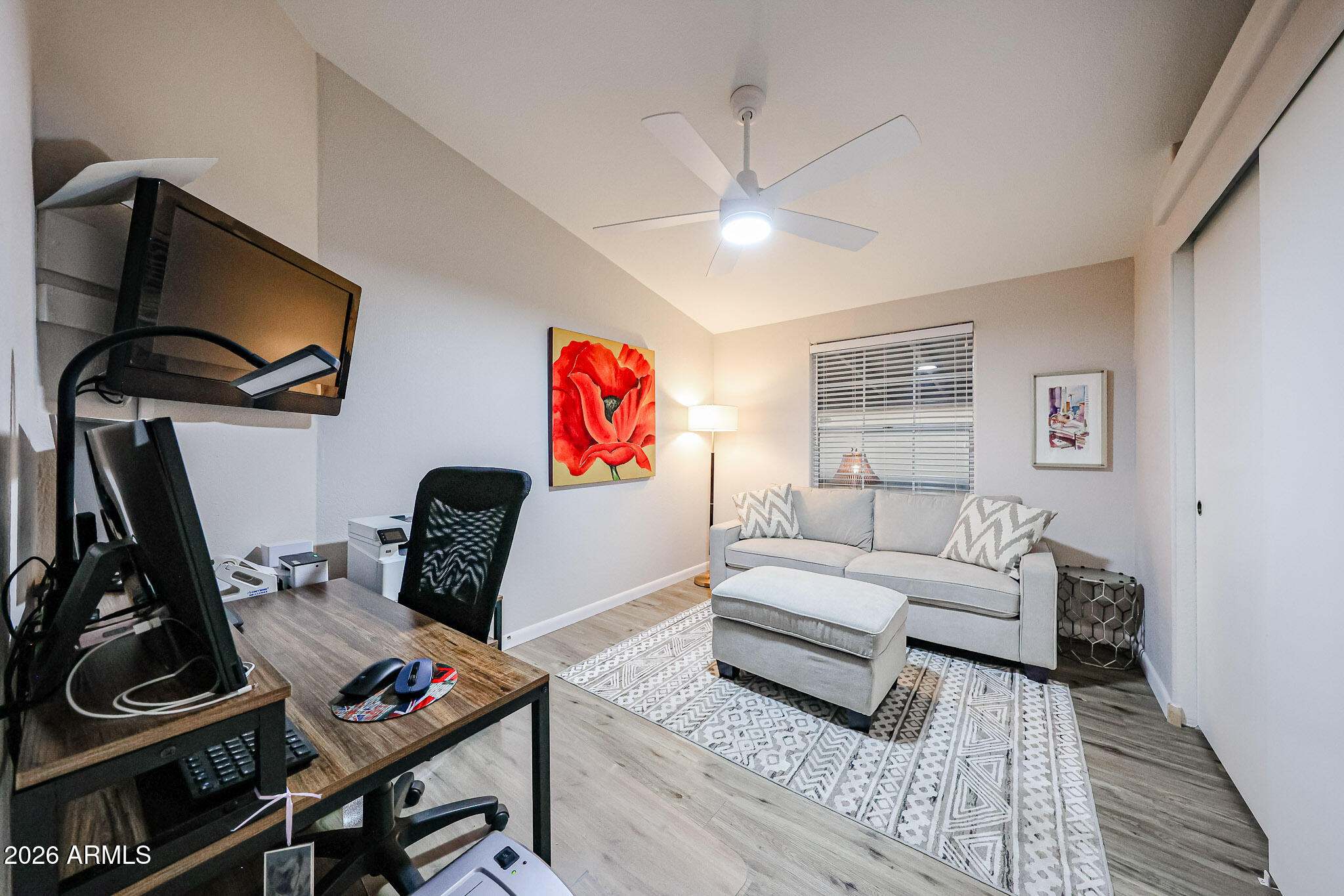 3901 East Pinnacle Peak Road, Unit 109 Phoenix, AZ 85050 - Photo 19 of 31 a living room with furniture and a flat screen tv