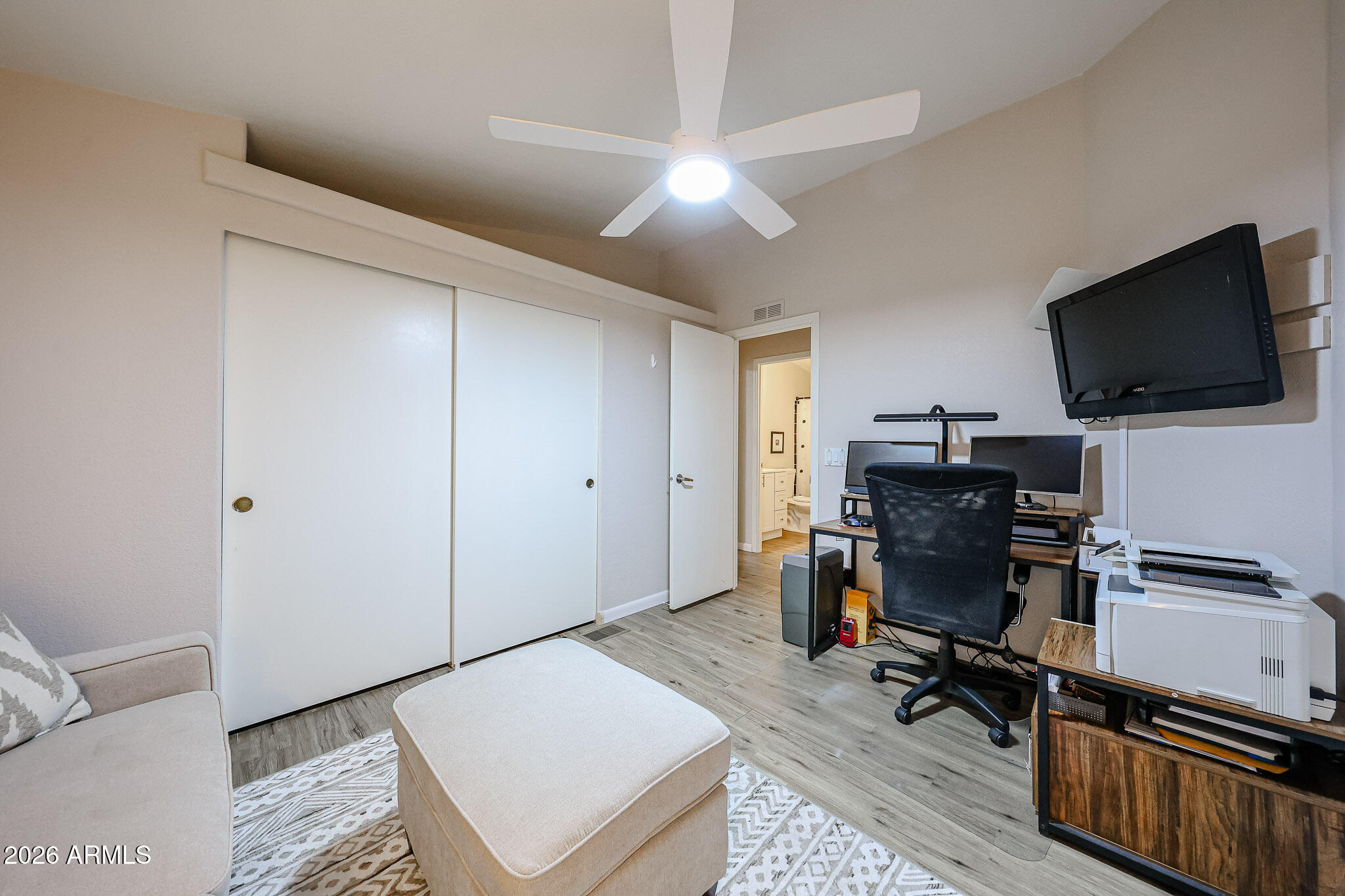 3901 East Pinnacle Peak Road, Unit 109 Phoenix, AZ 85050 - Photo 20 of 31 a view of a livingroom with workspace and a window