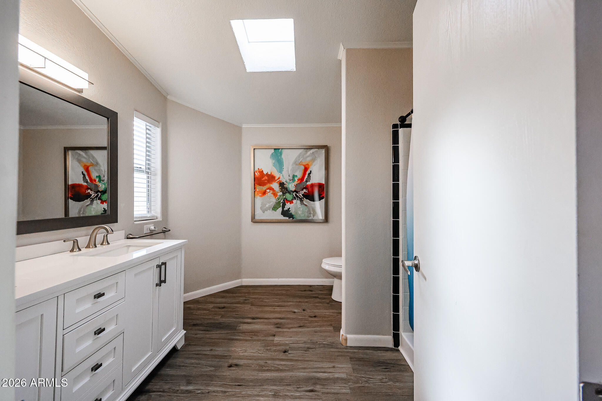 3901 East Pinnacle Peak Road, Unit 109 Phoenix, AZ 85050 - Photo 24 of 31 a spacious bathroom with a double vanity sink and a mirror