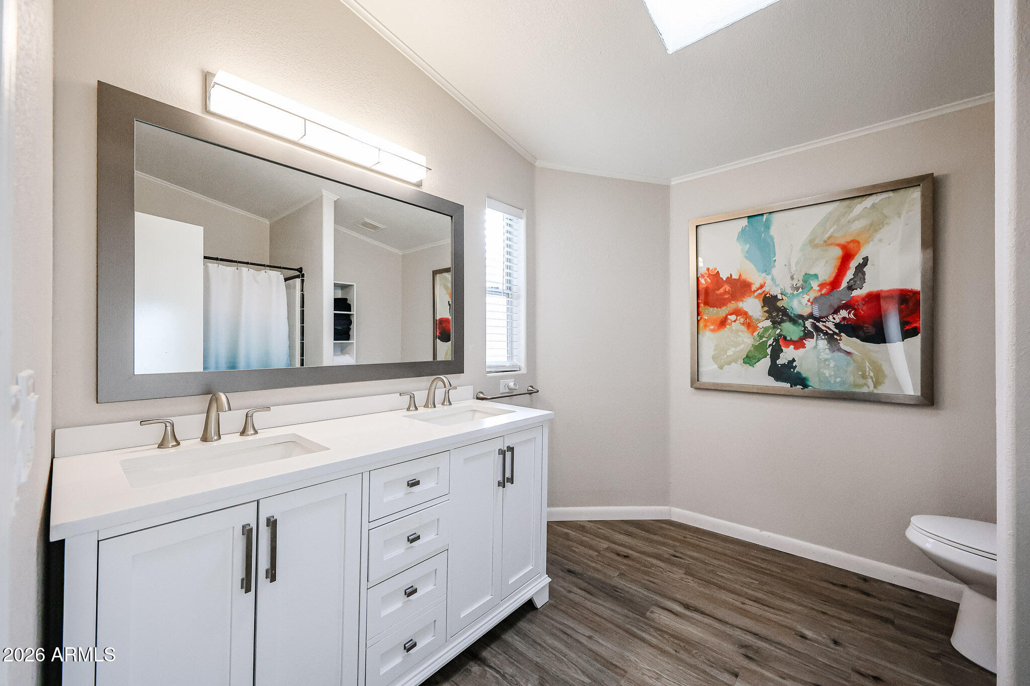 3901 East Pinnacle Peak Road, Unit 109 Phoenix, AZ 85050 - Photo 25 of 31 a spacious bathroom with a double vanity sink and a mirror