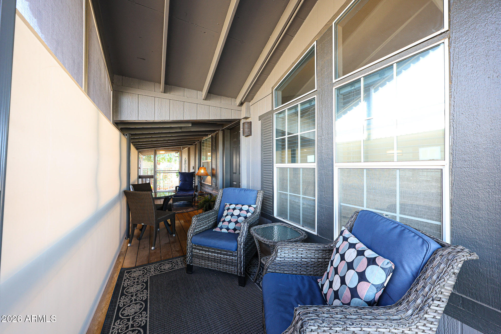 3901 East Pinnacle Peak Road, Unit 109 Phoenix, AZ 85050 - Photo 28 of 31 a living room with furniture and a large window