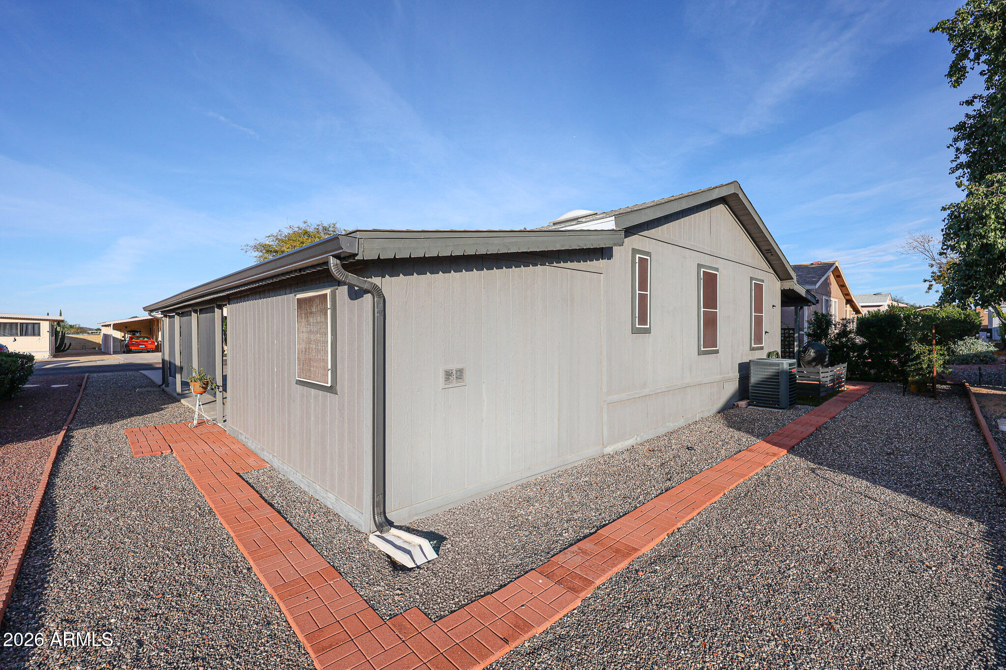 3901 East Pinnacle Peak Road, Unit 109 Phoenix, AZ 85050 - Photo 31 of 31 a front view of a house with a yard