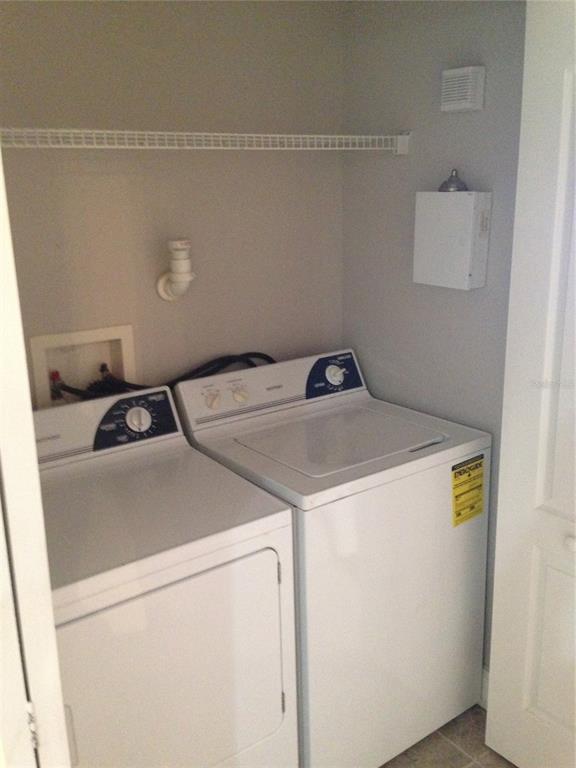 3373 South Kirkman Road, Unit 935 Orlando, FL 32811 - Photo 11 of 20 a utility room with dryer and washer