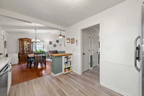 a kitchen with stainless steel appliances a stove a microwave and a refrigerator