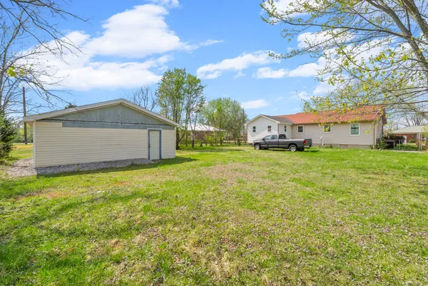 a view of a house with a back yard