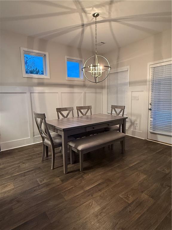 358 Mulberry Road Winder, GA 30680 - Photo 3 of 21 a view of a dining room with furniture wooden floor and chandelier
