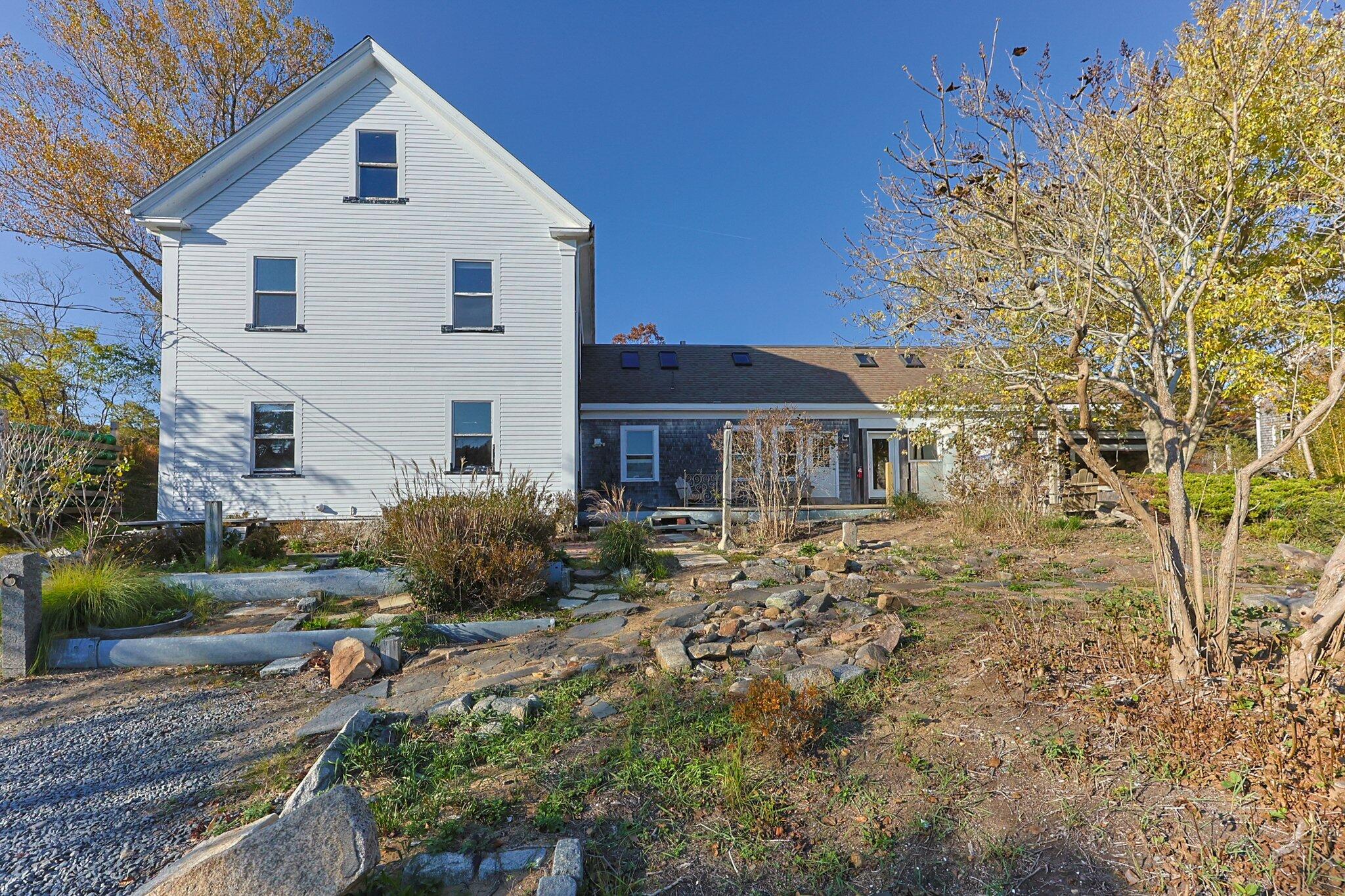 9 Peters Pond Road Truro, MA 02666 - Photo 1 of 35 a front view of a house with garden