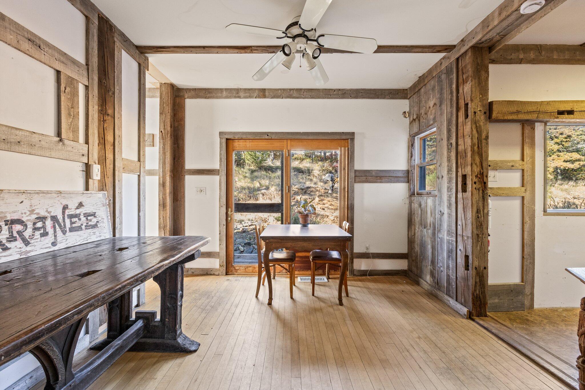 9 Peters Pond Road Truro, MA 02666 - Photo 21 of 35 a view of a dining room with furniture window and wooden floor