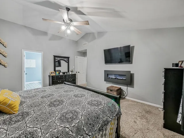 a view of a livingroom with furniture and a flat screen tv